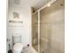 Clean bathroom with a walk-in shower and tile surround at 7510 Seven Eagles Way # 7510, Reunion, FL 34747