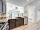 Well-appointed kitchen with granite countertops and stainless steel appliances, open to the living area at 7510 Seven Eagles Way # 7510, Reunion, FL 34747