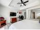 King-size bed and ensuite bathroom in main bedroom at 7510 Seven Eagles Way # 7510, Reunion, FL 34747