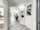 Bright entry hall with wood-look floors, leading to bedroom and living areas at 7510 Seven Eagles Way # 7510, Reunion, FL 34747