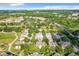 Aerial view of community with golf course, tennis courts, and pool at 7510 Seven Eagles Way # 7510, Reunion, FL 34747
