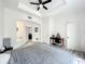 Spacious main bedroom with a large bed, an en-suite bathroom, and a home office area at 7510 Seven Eagles Way # 7510, Reunion, FL 34747