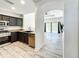 Modern kitchen with granite counters and open floor plan at 7510 Seven Eagles Way # 7510, Reunion, FL 34747