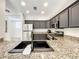 Granite countertops and stainless steel sink in modern kitchen at 7510 Seven Eagles Way # 7510, Reunion, FL 34747