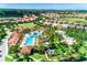 Large community pool with expansive deck and surrounding homes at 7635 Oakmoss Loop, Davenport, FL 33837
