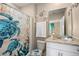 Clean bathroom with a turtle-themed shower curtain at 7635 Oakmoss Loop, Davenport, FL 33837