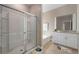 Clean bathroom with a shower, bathtub, and granite countertop at 7635 Oakmoss Loop, Davenport, FL 33837