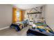 Twin bedroom with Minion-themed bedding and mural at 7635 Oakmoss Loop, Davenport, FL 33837