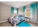 Ocean-themed bedroom with a double bed at 7635 Oakmoss Loop, Davenport, FL 33837