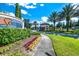 Gated community entrance with landscaping and signage at 7635 Oakmoss Loop, Davenport, FL 33837