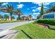 Gated community entrance with landscaping and signage at 7635 Oakmoss Loop, Davenport, FL 33837