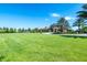 Community green space with grassy area and clubhouse at 7635 Oakmoss Loop, Davenport, FL 33837
