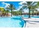Expansive pool area with palm trees and seating at 7635 Oakmoss Loop, Davenport, FL 33837