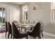 Elegant dining room with a table for six and Aladdin decor at 7635 Oakmoss Loop, Davenport, FL 33837