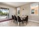 Dining room with table and chairs, overlooking the pool area at 7635 Oakmoss Loop, Davenport, FL 33837