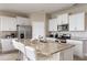 Modern kitchen featuring granite countertops and stainless steel appliances at 7635 Oakmoss Loop, Davenport, FL 33837