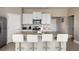 Kitchen with granite countertops and white cabinetry at 7635 Oakmoss Loop, Davenport, FL 33837