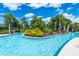 Lazy river pool with lush tropical landscaping at 7635 Oakmoss Loop, Davenport, FL 33837
