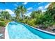 Serene lazy river surrounded by tropical foliage at 7635 Oakmoss Loop, Davenport, FL 33837