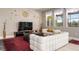 Bright living room with ample seating and a large TV at 7635 Oakmoss Loop, Davenport, FL 33837