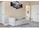 Elegant living room with a comfortable sofa and large artwork at 7635 Oakmoss Loop, Davenport, FL 33837