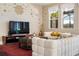 Living Room with comfy seating and large TV at 7635 Oakmoss Loop, Davenport, FL 33837