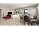 Open concept living and dining area with access to the pool at 7635 Oakmoss Loop, Davenport, FL 33837