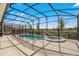 Screened pool and spa with a spacious deck at 7635 Oakmoss Loop, Davenport, FL 33837