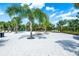Relaxing pool deck with lounge chairs and palm trees at 7635 Oakmoss Loop, Davenport, FL 33837