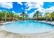 Large resort-style pool with water features at 7635 Oakmoss Loop, Davenport, FL 33837
