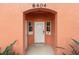 White front door with keypad entry and arched alcove at 8404 Crystal Cove Loop, Kissimmee, FL 34747