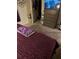 Bedroom with purple bedding, carpeted floor, and a dresser at 106 Orchid Ct, Kissimmee, FL 34759
