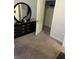 Bedroom with dresser, mirror and walk-in closet at 106 Orchid Ct, Kissimmee, FL 34759