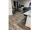 Living room with light gray couch and wood-look flooring at 106 Orchid Ct, Kissimmee, FL 34759