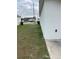 Side yard view of home with grassy area at 106 Orchid Ct, Kissimmee, FL 34759