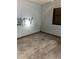Empty bedroom with light blue walls and wood floors at 1604 Royal Palm Dr, Edgewater, FL 32132