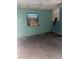 Empty bedroom with light teal walls and wood floors at 1604 Royal Palm Dr, Edgewater, FL 32132