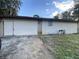 Ranch style home with a large attached garage and driveway at 1604 Royal Palm Dr, Edgewater, FL 32132
