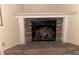Brick fireplace with white mantel and large logs at 1604 Royal Palm Dr, Edgewater, FL 32132