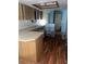 Kitchen with wood laminate floors and cabinets at 1604 Royal Palm Dr, Edgewater, FL 32132