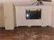Living room with wood floors and a window at 1604 Royal Palm Dr, Edgewater, FL 32132