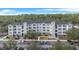 Three-story apartment building with parking and landscaping at 3176 Feltrim Pl # 102, Kissimmee, FL 34747