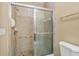 Bathroom with shower stall and tiled walls at 3176 Feltrim Pl # 102, Kissimmee, FL 34747