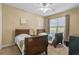 Bedroom with two twin beds, ample closet space, and large window at 3176 Feltrim Pl # 102, Kissimmee, FL 34747