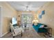 Bright living room with comfy seating, large TV, and sliding door access to patio at 3176 Feltrim Pl # 102, Kissimmee, FL 34747