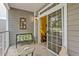 Small patio with seating and access to the interior of the home at 3176 Feltrim Pl # 102, Kissimmee, FL 34747