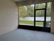 Enclosed patio with view of backyard and privacy fence at 3480 Home Town Ln, Saint Cloud, FL 34769