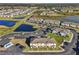 Aerial view of townhome community near a pond at 439 Annabelle Way, Davenport, FL 33837