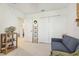 Relaxing bedroom with comfortable sofa and built-in shelving at 439 Annabelle Way, Davenport, FL 33837
