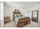 Bright bedroom with wooden bed frame and full-length mirror at 439 Annabelle Way, Davenport, FL 33837
